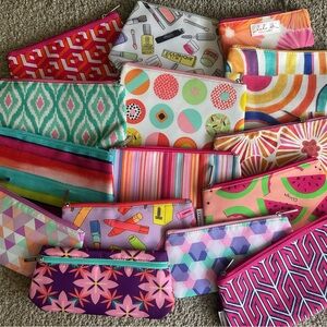 Various Clinique cosmetic bags